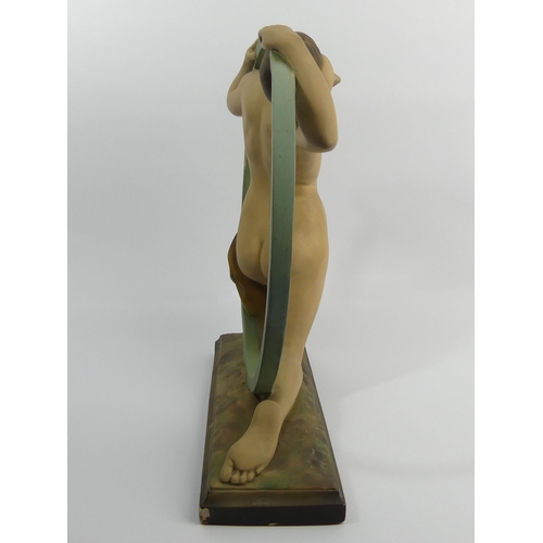 381 - Classic Art Deco plaster girl in a hoop figure, reg no 818406, 37cm high.