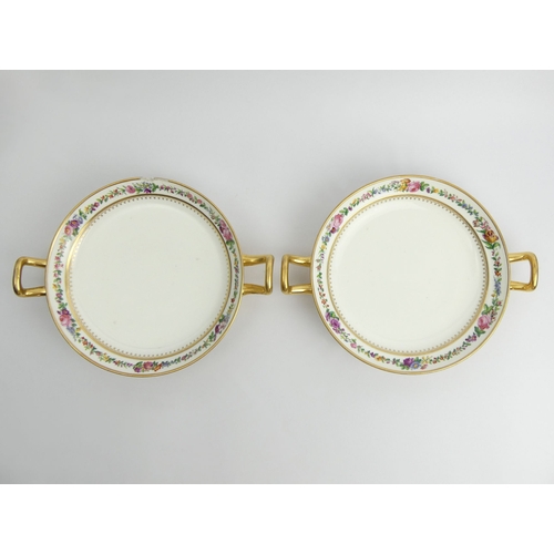 383 - Two Sevres twin handled porcelain dishes, decorated with a floral band, 27cm x 5cm.