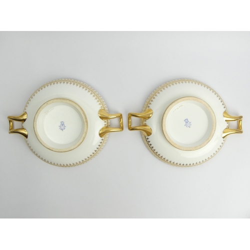 383 - Two Sevres twin handled porcelain dishes, decorated with a floral band, 27cm x 5cm.