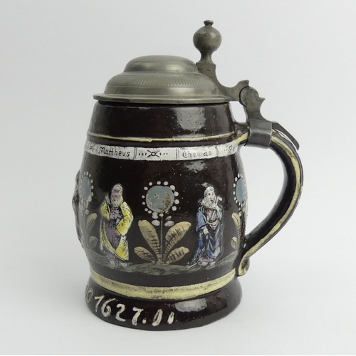 386 - German slip ware, pewter lidded stein, decorated with the Apostles in relief and dated Anno 1627, 15... 