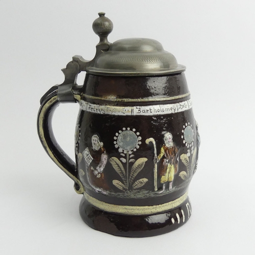 386 - German slip ware, pewter lidded stein, decorated with the Apostles in relief and dated Anno 1627, 15... 