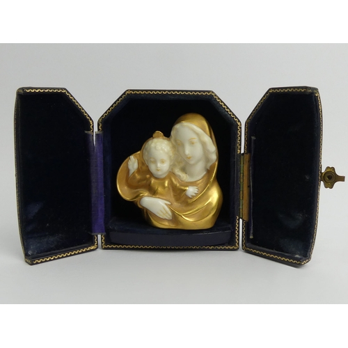 387 - C. 1900 German porcelain Jesus and Mary gilded porcelain bust in a fitted case, bust 7cm.