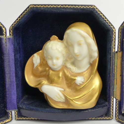 387 - C. 1900 German porcelain Jesus and Mary gilded porcelain bust in a fitted case, bust 7cm.