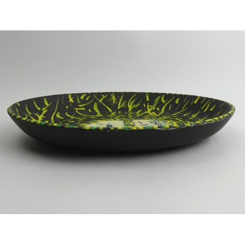 389 - Hand painted oval pottery dish, insect design, signed J.P. 73 probably John Piper, 37cm x 27.5cm.