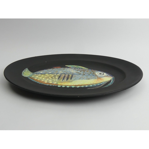 390 - Hand painted oval pottery dish, fish design, signed J.P. 73, probably John Piper, 40cm x 32cm.