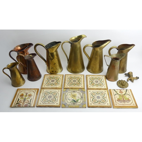 401 - Eight Victorian tiles and a quantity of copper and brass jugs.