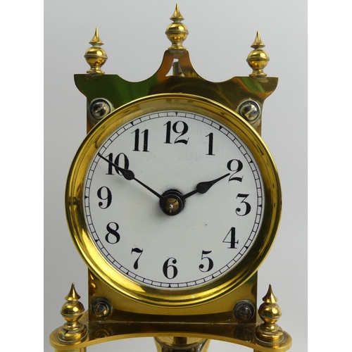 408 - Brass anniversary clock with an enamel dial and glass dome, 30cm.