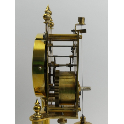 408 - Brass anniversary clock with an enamel dial and glass dome, 30cm.