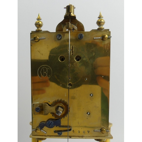 408 - Brass anniversary clock with an enamel dial and glass dome, 30cm.