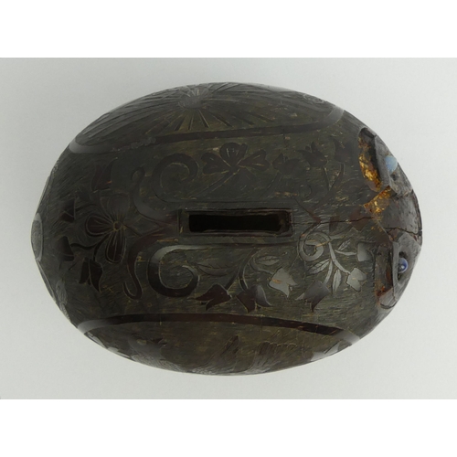 449 - Spanish colonial carved coconut money box decorated with a bull fighting and other signs.