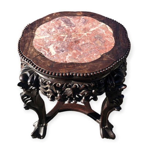 497A - Early 20th century Chinese carved hardwood jardiniere stand with an inset marble top. Collection onl... 