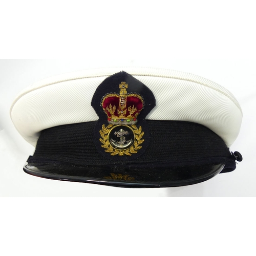 212 - Three naval caps together with two boxes of army ties, one hat marked size 7.