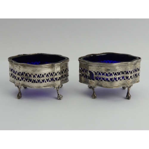 170 - A pair of silver salts, Chester 1898, with blue glass liners, 91 grams, 9cm x 5cm.