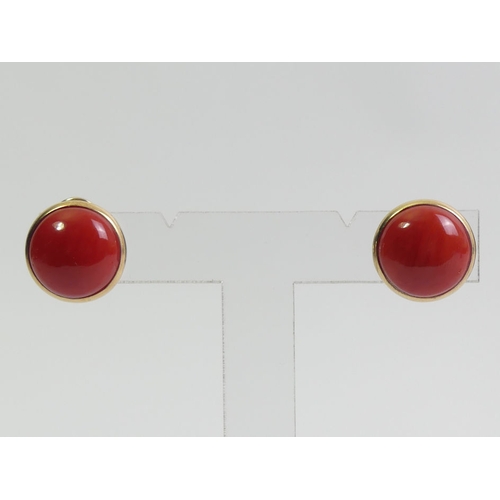 103 - A pair of 18ct gold coral set earrings, 8.3 grams, 16.6mm diameter.