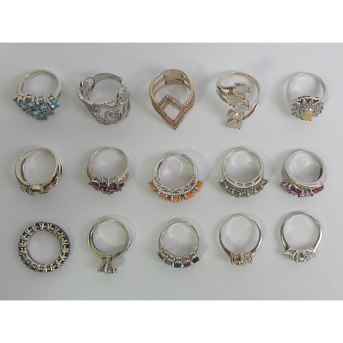 111 - Fifteen sterling silver rings including topaz and sapphire examples, 64 grams.