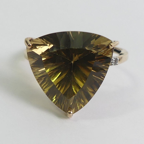 113 - 9ct gold citrine and diamond ring, 3.1 grams, 14.8mm, size O.