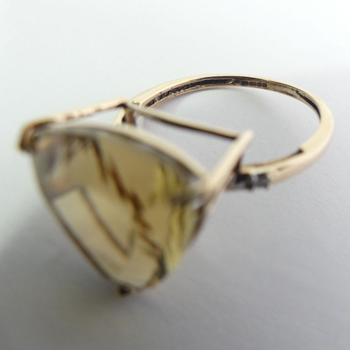 113 - 9ct gold citrine and diamond ring, 3.1 grams, 14.8mm, size O.