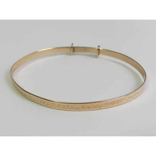 120 - 9ct gold expanding bangle, 7.2 grams, 6.6mm at it's widest.