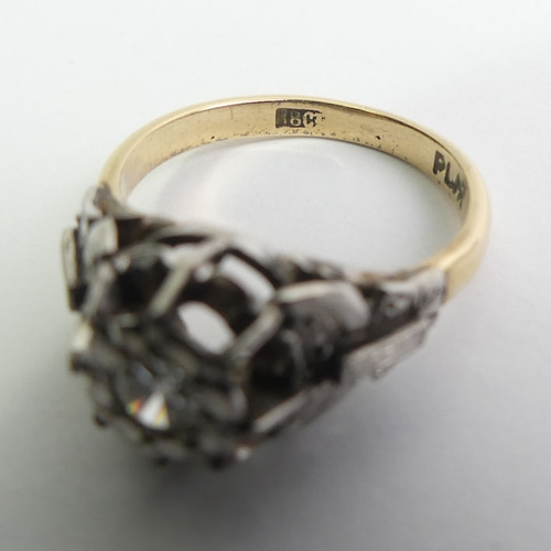 123 - 18ct gold and platinum diamond ring (approx. .25ct), 4.7 grams, 10mm, size O.