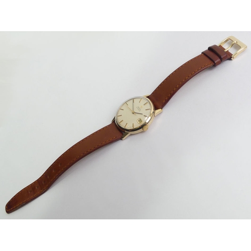 138 - Omega 9ct gold automatic date adjust gents watch on a leather strap, 34mm inc. button.
Condition Rep... 