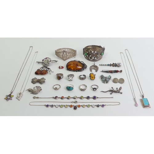 1 - A mixed lot of mostly silver jewellery including a large amber pendant.