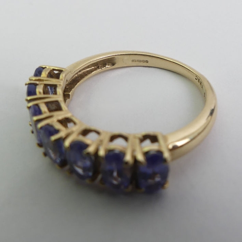 17 - 9ct gold tanzanite seven stone ring, 2.1 grams, 5.1mm, size J 1/2.