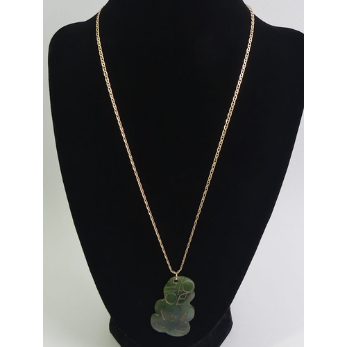 22 - New Zealand Jade tiki pendant and 9ct gold chain, 2.6 grams, tiki 40mm x 26mm, chain 48cm.