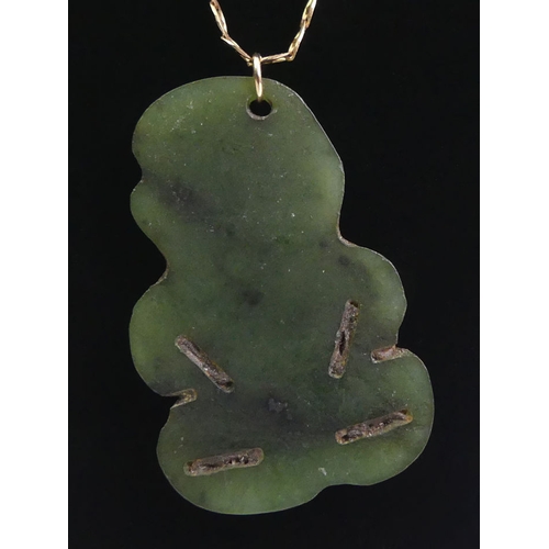 22 - New Zealand Jade tiki pendant and 9ct gold chain, 2.6 grams, tiki 40mm x 26mm, chain 48cm.