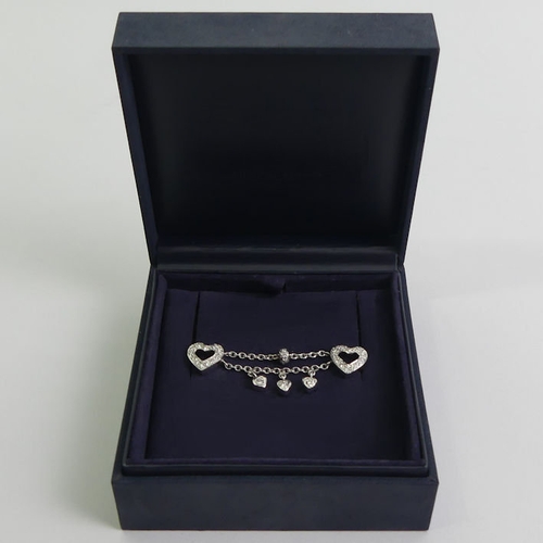 28 - 14ct white gold diamond set linked collar studs, 6.3 grams excluding sprung backs, 55mm x 10mm.