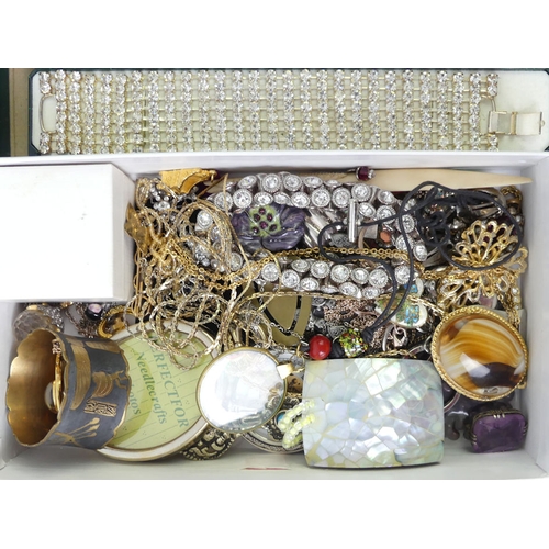 35 - A tray of mixed costume jewellery including stone set bracelets.