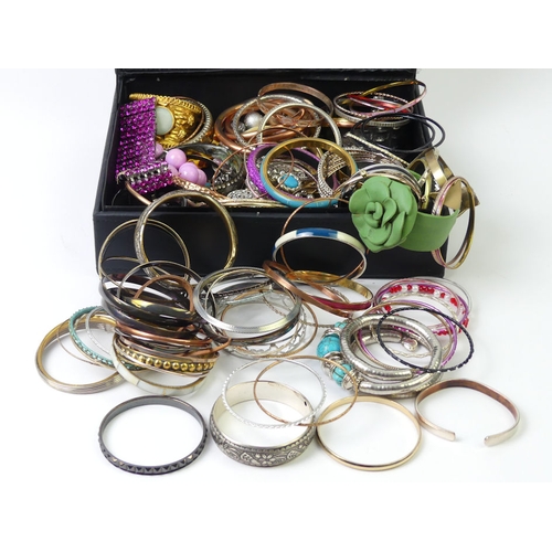 39 - A case of bangles and bracelets including rolled gold.