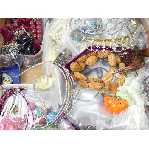 40 - A box of assorted costume jewellery including tiaras.