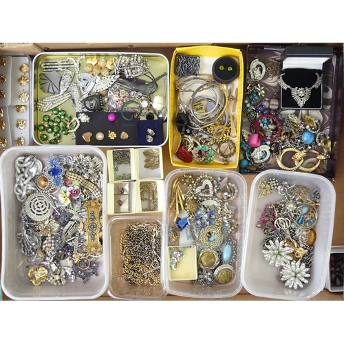 44 - A box of costume jewellery including watch chains.