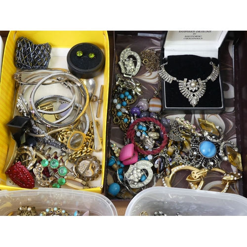 44 - A box of costume jewellery including watch chains.