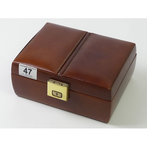 47 - A leather jewellery box and contents including silver rings.