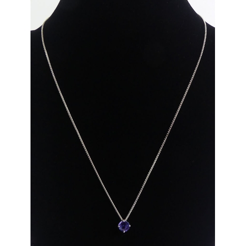 51 - 18ct white gold tanzanite pendant and chain, 3.3 grams, tanzanite 6.8mm, chain 4cm.