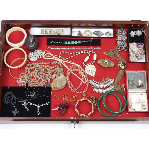 63 - A stall holder's display cabinet and contents including a silver and diamond bracelet, 38cm x 55cm.