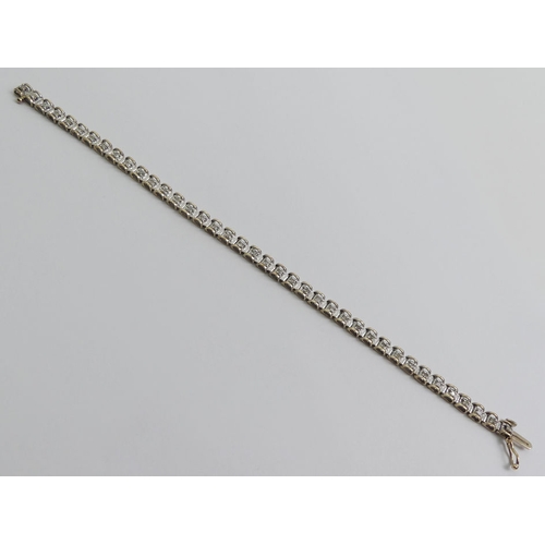 70 - 9ct gold diamond set line bracelet, 7.5 grams, 4.6mm, 18cm.