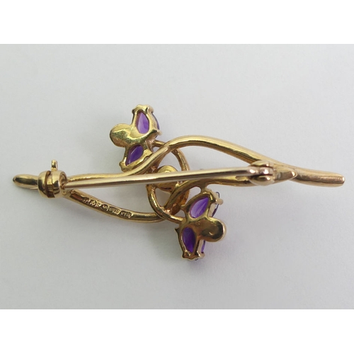 80 - 9ct gold amethyst and cultured pearl brooch, 3.5 grams, 45.6mm wide.