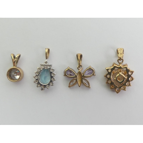 86 - 9ct gold blue topaz pendant, a 9ct gold CZ pendant and two 9ct gold single stone pendants, 4.1 grams... 