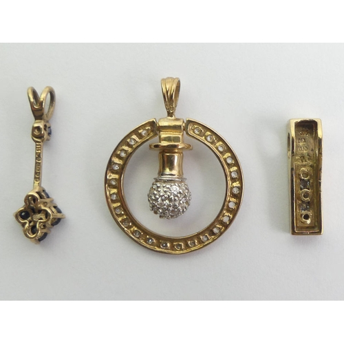 87 - 9ct gold CZ pendant, a 9ct gold diamond pendant and a sapphire pendant, 5.3 grams.