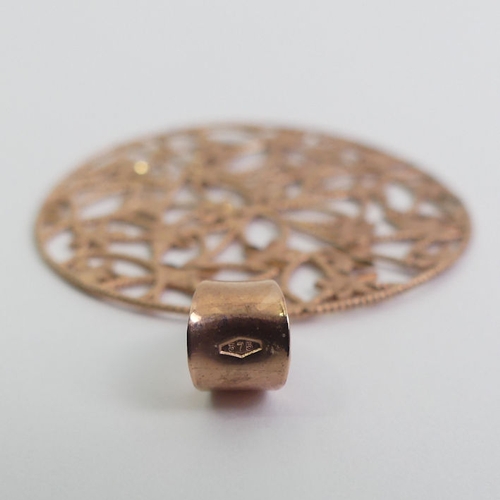 9 - 9ct rose gold foliate design pendant, 3.6 grams, 36.5mm in diameter.