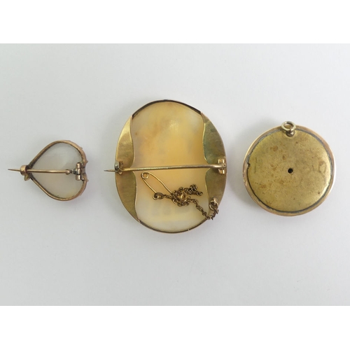 92 - Three gold mounted brooches, one in the form of a heart, one a cameo and one porcelain, cameo 42mm x... 