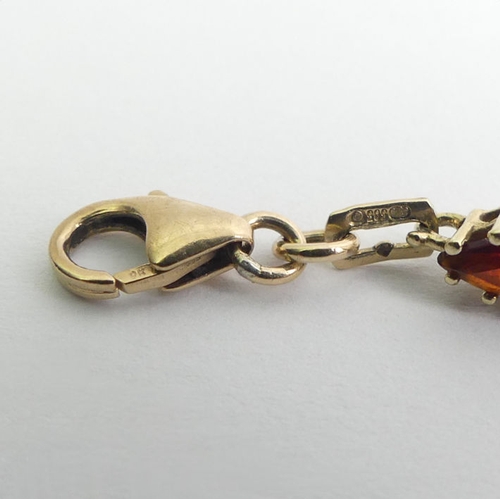 125A - 9ct gold garnet bracelet, 8.5 grams, 20cm x 5mm.