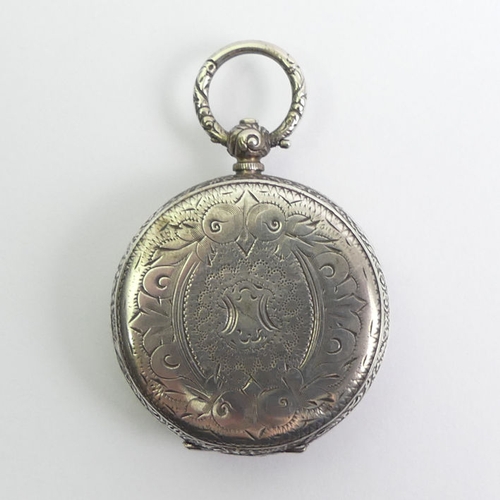 130 - Silver fancy dial open face key wind pocket watch, 39mm x 58mm.
Condition Report: In working order.