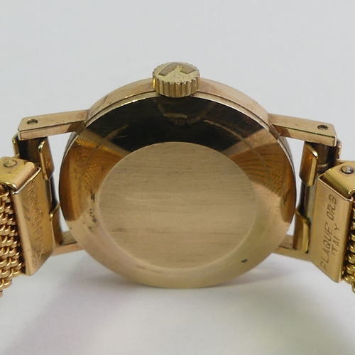 143 - Ladies 9ct gold manual wind watch on an expanding strap, 23.1mm wide.
Condition Report: In working o... 