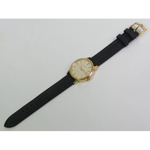 145 - Gents Omega gold tone quartz date adjust watch on a black leather strap and in a fitted box, 37mm in... 