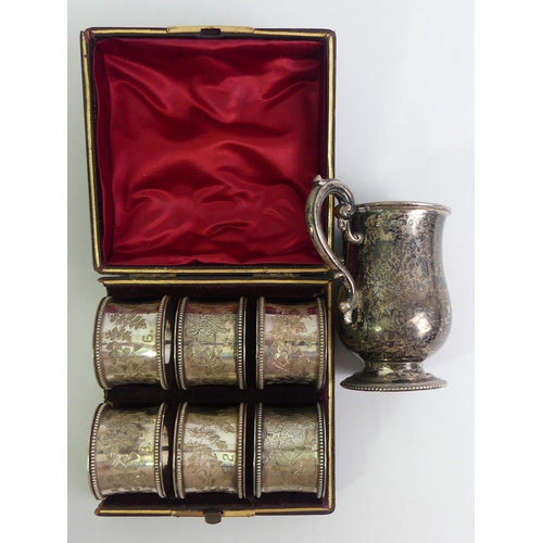 167 - Victorian silver christening tankard, Sheffield 1870, 90 grams, and a boxed set of six plated napkin... 