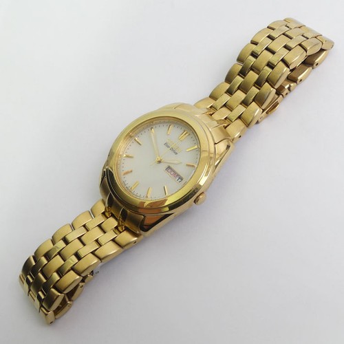 140 - Gents gold tone Citizen Eco-Drive day date adjust watch, 36mm inc. button.
Condition Report: In good... 