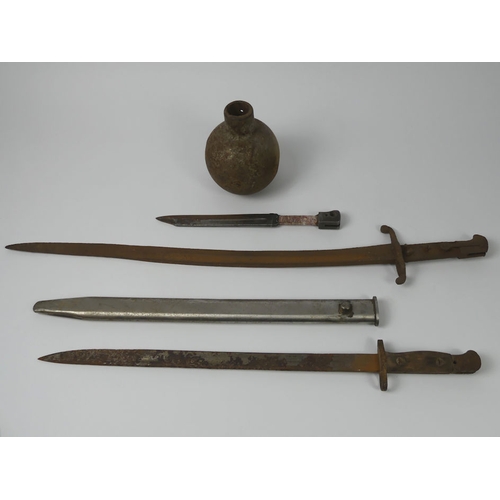 206 - Three old bayonets and a grenade, longest bayonet 69.5cm.